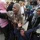 Egyptians react outside a courtroom in Minya, Egypt, after a court sentenced Muslim Brotherhood leader Mohamed Badie and 682 other alleged Islamists to death April 28, 2014, on charges they were involved in the murder and attempted murder of police during a clash between officers and supporters of ousted President Mohamed Morsi in Cairo in August 2013.
KHALED DESOUKI/AFP/Getty Images